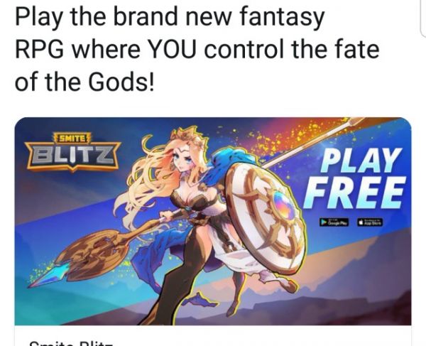 Advertisment for Smite Blitz with a blonde woman wearing a crown and a bustier showing her breasts, holding a shield and a lance, she is bending forward with her front leg toward us and a very distant back leg bending away 