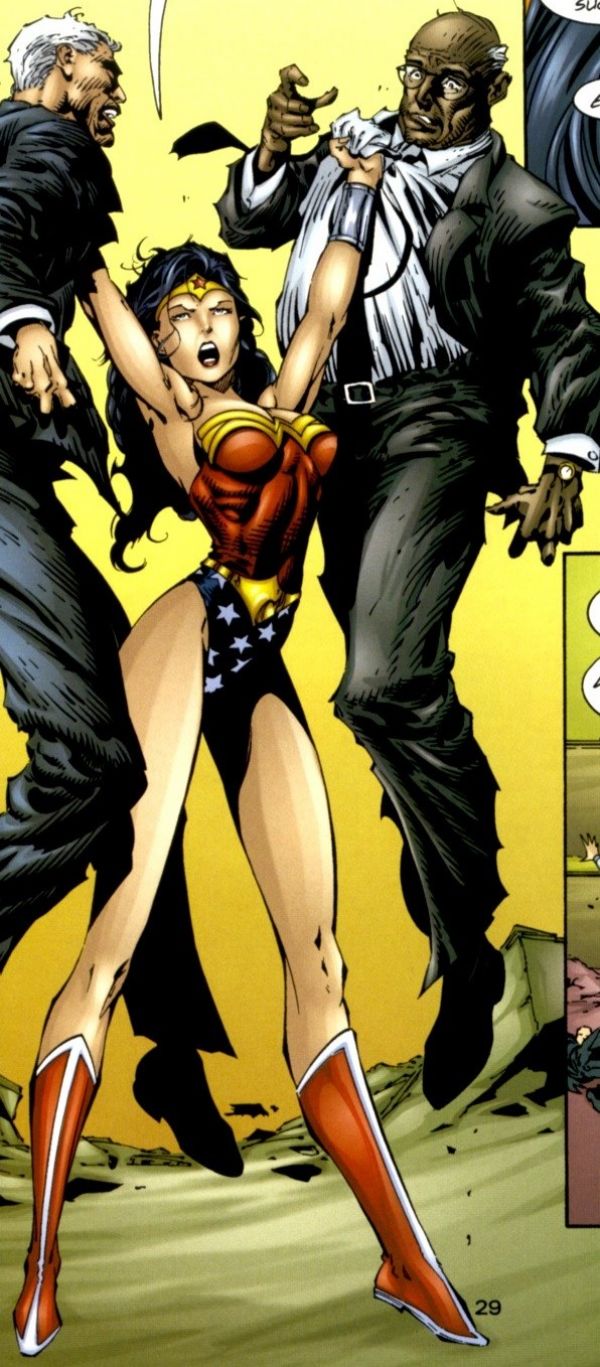 zoom of Wonder Woman in JLA/Witchblade holding two men in suits with her waist and back cinched in